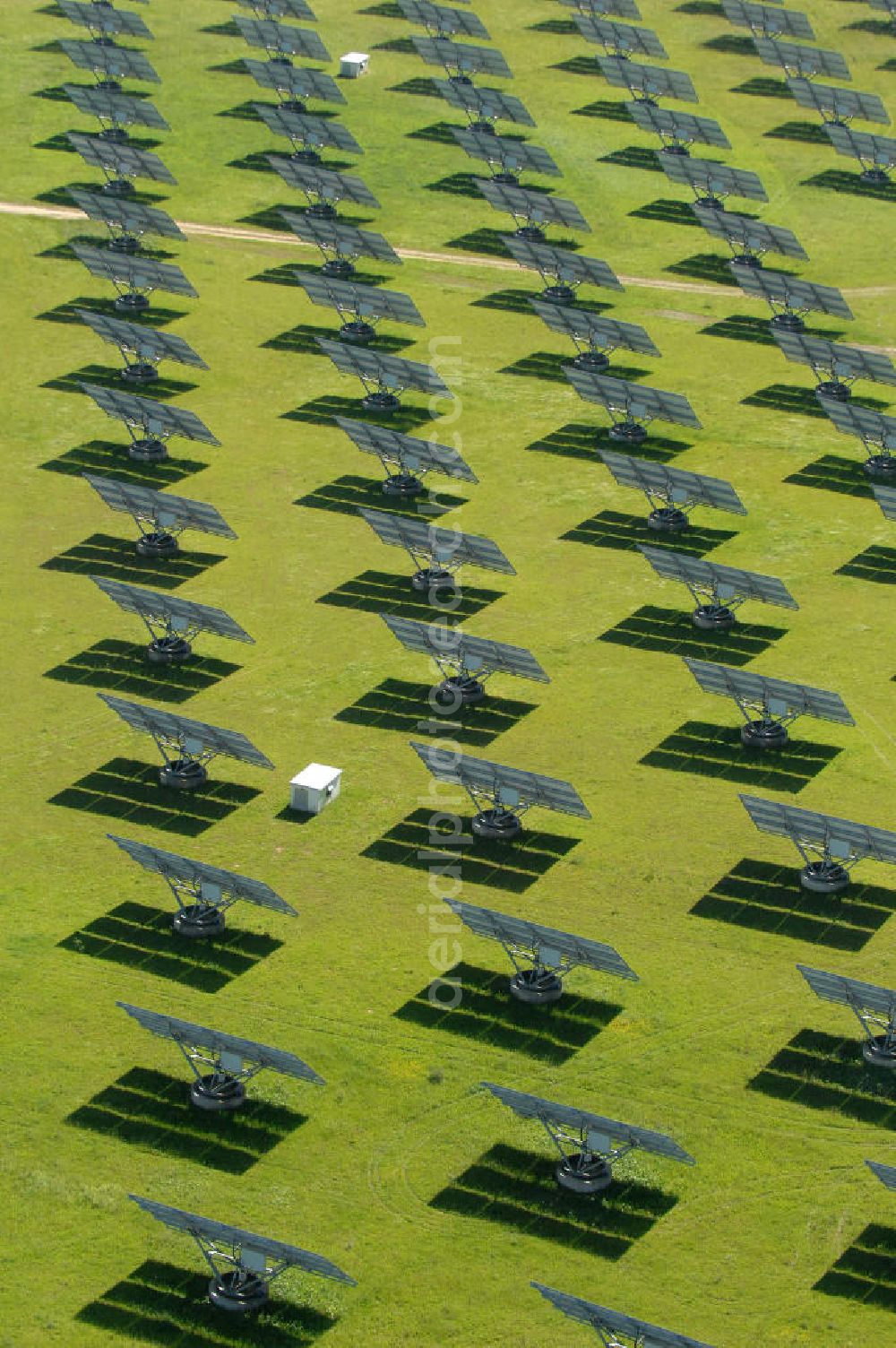 Aerial photograph Arnstein - Blick auf das Solarfeld Erlasee (auch Solarstrompark Gut Erlasee) einem 2008 auf dem ehemaligen fränkischen Weingut Erlasee bei Arnstein im Landkreis Main-Spessart (Bayern) errichtetes Solarkraftwerk. Es ist ein Gemeinschaftsprojekt des Berliner Solarmodulherstellers Solon SE, des Projektierungs- und Vertriebsunternehmens S.A.G. Solarstrom AG und der E.ON Bayern AG. Jedes Feld ist auf einem drehbaren Untergestell montiert, was eine exakte Ausrichtung der Solarmodule zur Sonne hin ermöglicht. View of the solar field Erlasee (solar Park Good Erlasee) a 2008 on the former Frankish at Weingut Erlasee Arnstein in the district Main-Spessart (Bavaria) built solar power plant.