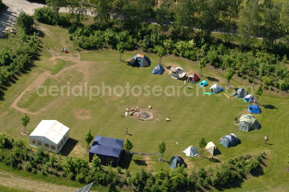 Aerial image Arnstein - Blick auf einem Zeltplatz am Solarfeld Erlasee (auch Solarstrompark Gut Erlasee) einem 2008 auf dem ehemaligen fränkischen Weingut Erlasee bei Arnstein im Landkreis Main-Spessart (Bayern) errichtetes Solarkraftwerk. View of the campground on the solar field Erlasee, one in 2008 on the former Frankish at Weingut Erlasee Arnstein in the district of Main-Spessart (Bavaria) built solar power plant.