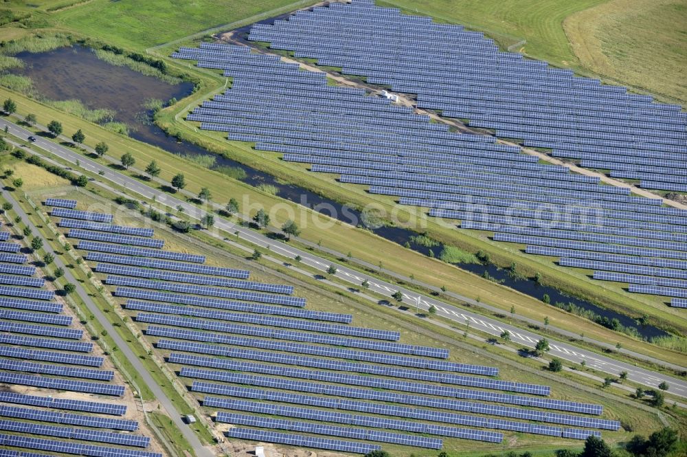 Aerial photograph Boizenburg - Boizenburg 08/07/2012 Newly built solar panel, photovoltaic solar park or along the road 5 on the industrial and commercial area of the eastern edge of Boizenburg / Elbe. The plant operator is the EEPro Company