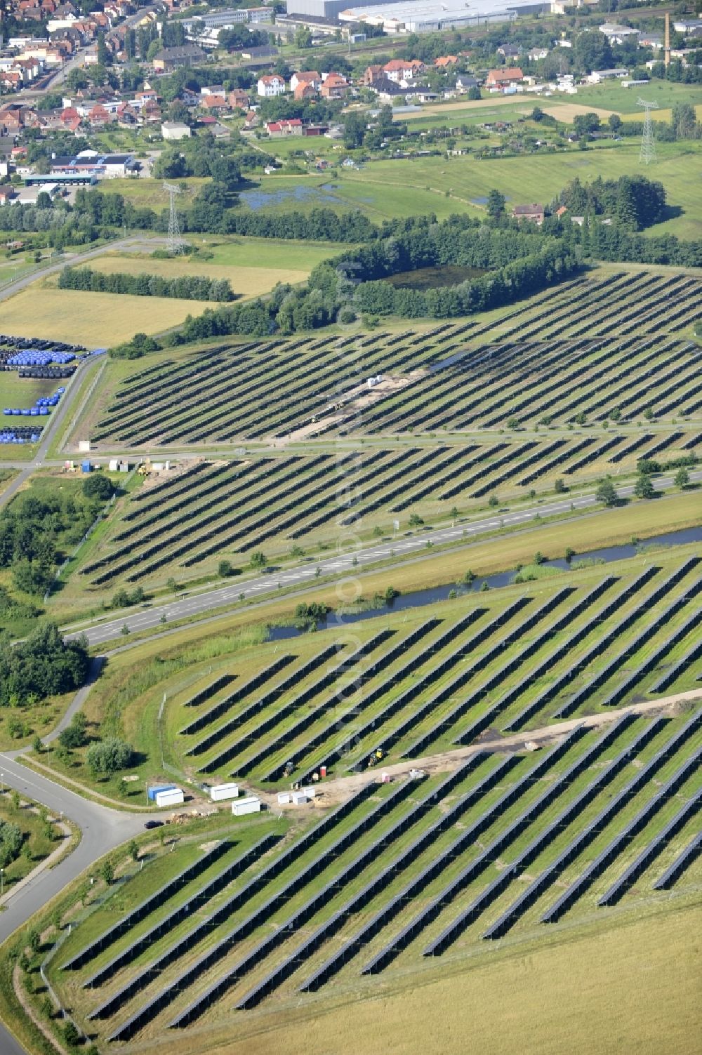 Aerial image Boizenburg - Boizenburg 08/07/2012 Newly built solar panel, photovoltaic solar park or along the road 5 on the industrial and commercial area of the eastern edge of Boizenburg / Elbe. The plant operator is the EEPro Company