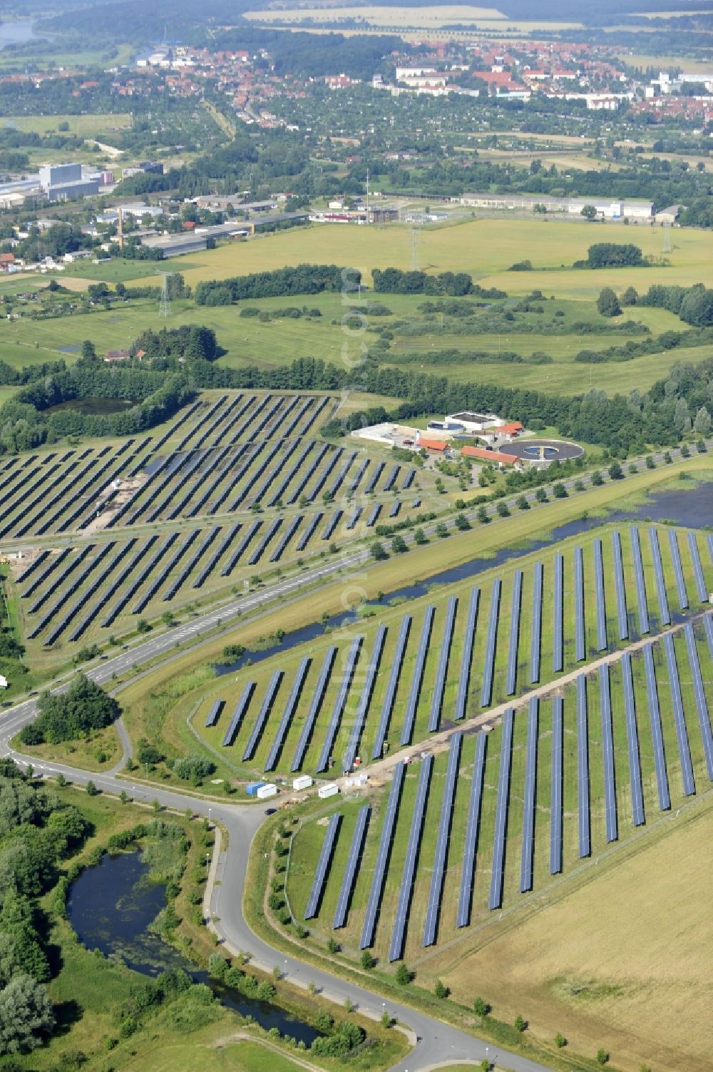 Aerial photograph Boizenburg - Boizenburg 08/07/2012 Newly built solar panel, photovoltaic solar park or along the road 5 on the industrial and commercial area of the eastern edge of Boizenburg / Elbe. The plant operator is the EEPro Company