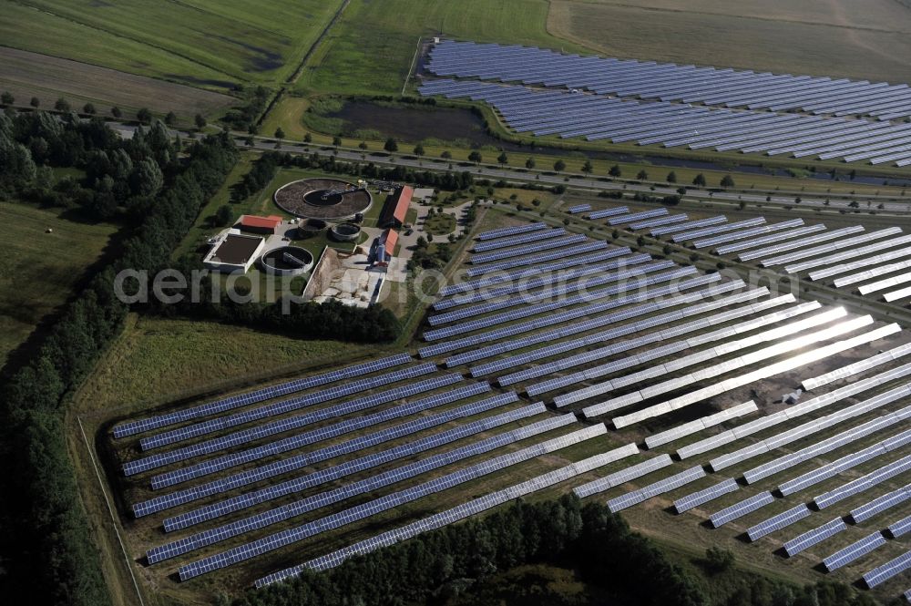 Boizenburg from the bird's eye view: Boizenburg 08/07/2012 Newly built solar panel, photovoltaic solar park or along the road 5 on the industrial and commercial area of the eastern edge of Boizenburg / Elbe. The plant operator is the EEPro Company