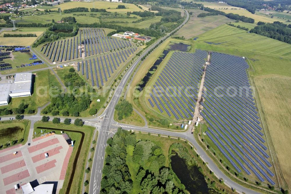 Boizenburg from above - Boizenburg 08/07/2012 Newly built solar panel, photovoltaic solar park or along the road 5 on the industrial and commercial area of the eastern edge of Boizenburg / Elbe. The plant operator is the EEPro Company