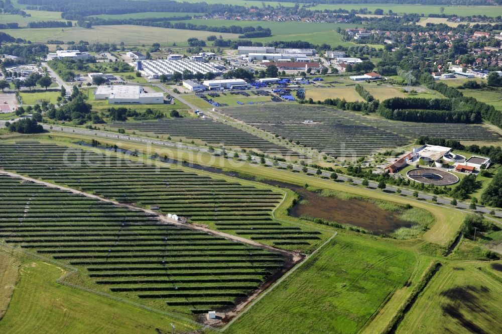 Boizenburg from above - Boizenburg 08/07/2012 Newly built solar panel, photovoltaic solar park or along the road 5 on the industrial and commercial area of the eastern edge of Boizenburg / Elbe. The plant operator is the EEPro Company