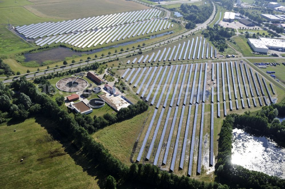 Boizenburg from above - Boizenburg 08/07/2012 Newly built solar panel, photovoltaic solar park or along the road 5 on the industrial and commercial area of the eastern edge of Boizenburg / Elbe. The plant operator is the EEPro Company