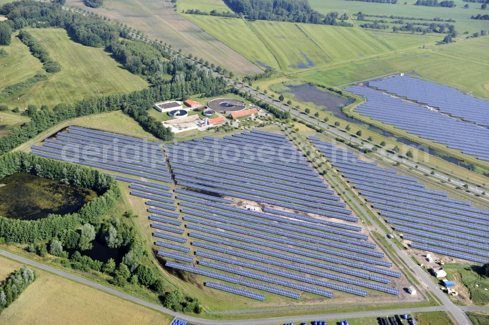 Boizenburg from the bird's eye view: Boizenburg 08/07/2012 Newly built solar panel, photovoltaic solar park or along the road 5 on the industrial and commercial area of the eastern edge of Boizenburg / Elbe. The plant operator is the EEPro Company