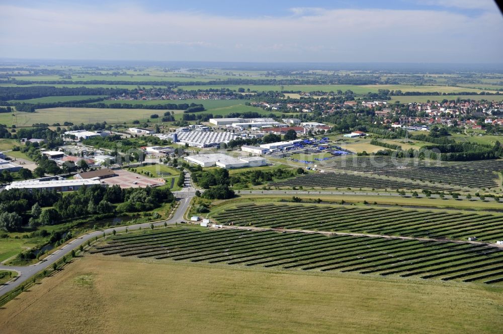 Boizenburg from above - Boizenburg 08/07/2012 Newly built solar panel, photovoltaic solar park or along the road 5 on the industrial and commercial area of the eastern edge of Boizenburg / Elbe. The plant operator is the EEPro Company