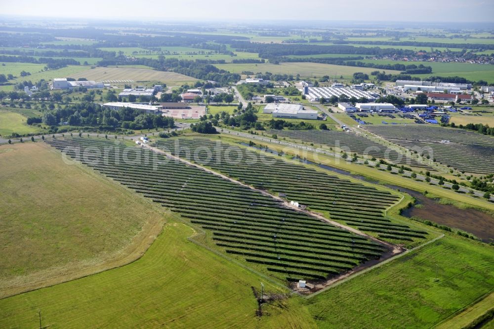 Boizenburg from the bird's eye view: Boizenburg 08/07/2012 Newly built solar panel, photovoltaic solar park or along the road 5 on the industrial and commercial area of the eastern edge of Boizenburg / Elbe. The plant operator is the EEPro Company