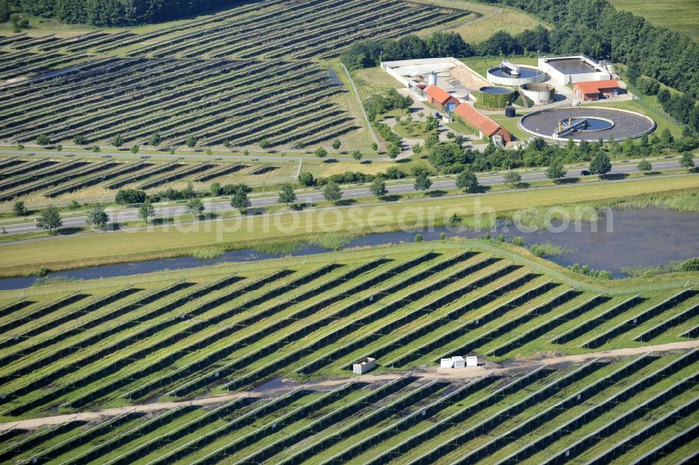 Boizenburg from above - Boizenburg 08/07/2012 Newly built solar panel, photovoltaic solar park or along the road 5 on the industrial and commercial area of the eastern edge of Boizenburg / Elbe. The plant operator is the EEPro Company