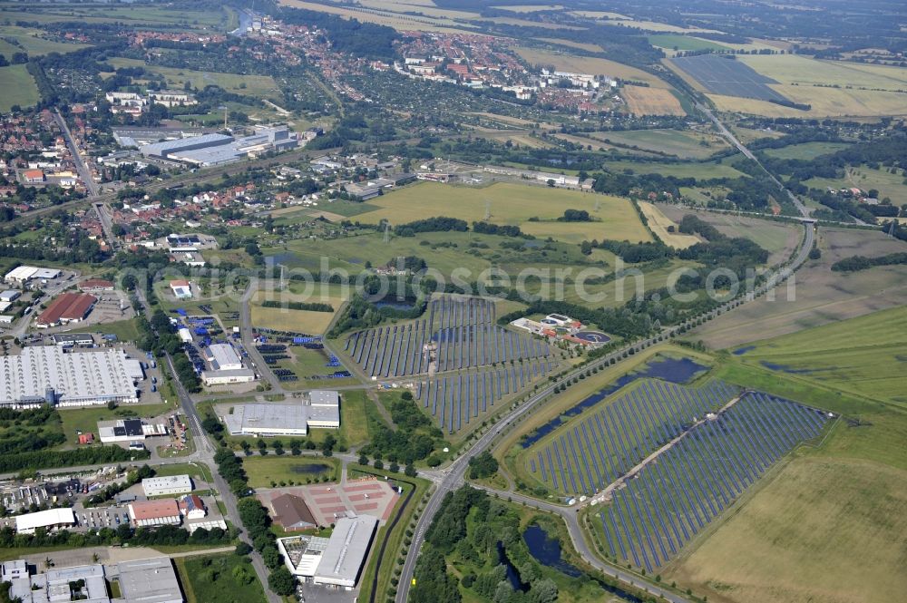 Boizenburg from the bird's eye view: Boizenburg 08/07/2012 Newly built solar panel, photovoltaic solar park or along the road 5 on the industrial and commercial area of the eastern edge of Boizenburg / Elbe. The plant operator is the EEPro Company