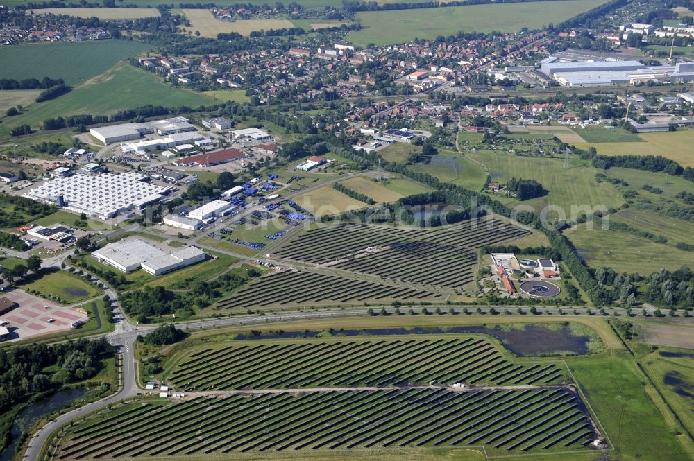 Boizenburg from above - Boizenburg 08/07/2012 Newly built solar panel, photovoltaic solar park or along the road 5 on the industrial and commercial area of the eastern edge of Boizenburg / Elbe. The plant operator is the EEPro Company