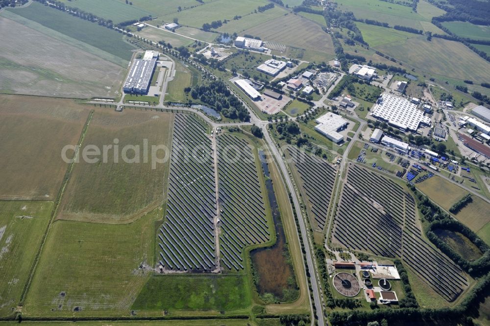 Boizenburg from the bird's eye view: Boizenburg 08/07/2012 Newly built solar panel, photovoltaic solar park or along the road 5 on the industrial and commercial area of the eastern edge of Boizenburg / Elbe. The plant operator is the EEPro Company