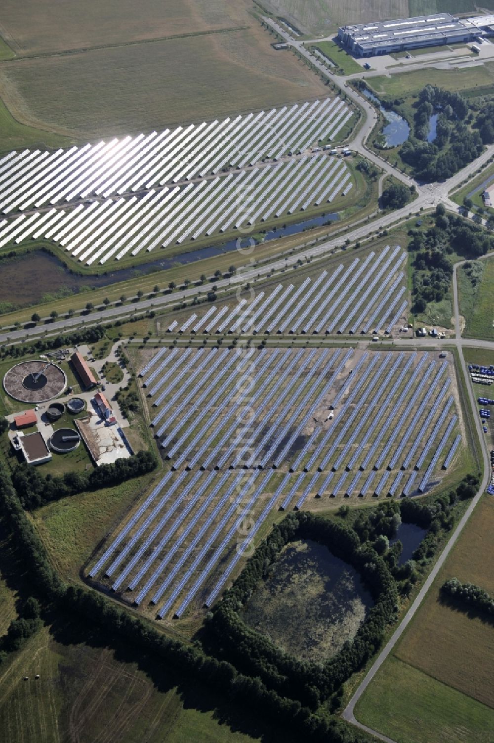 Aerial photograph Boizenburg - Boizenburg 08/07/2012 Newly built solar panel, photovoltaic solar park or along the road 5 on the industrial and commercial area of the eastern edge of Boizenburg / Elbe. The plant operator is the EEPro Company