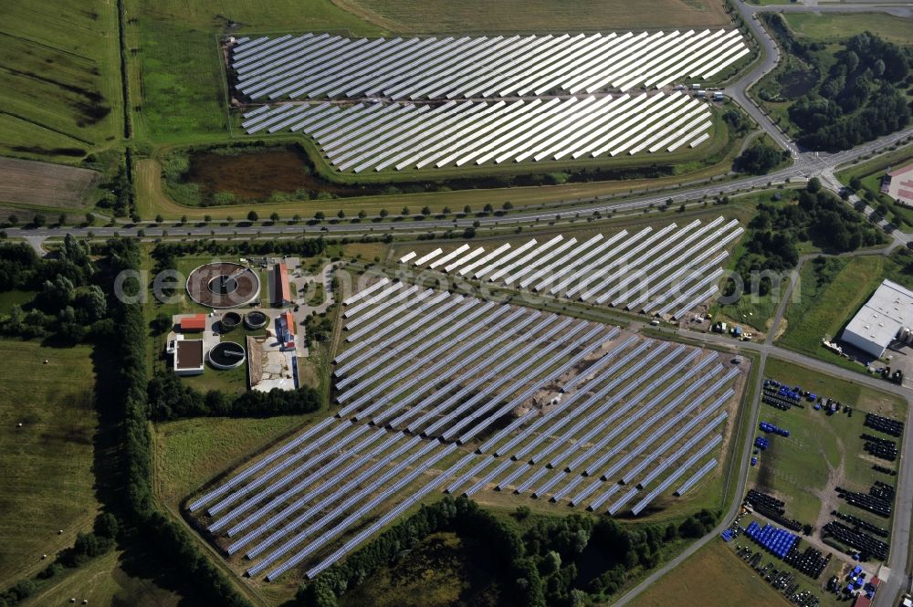 Boizenburg from above - Boizenburg 08/07/2012 Newly built solar panel, photovoltaic solar park or along the road 5 on the industrial and commercial area of the eastern edge of Boizenburg / Elbe. The plant operator is the EEPro Company