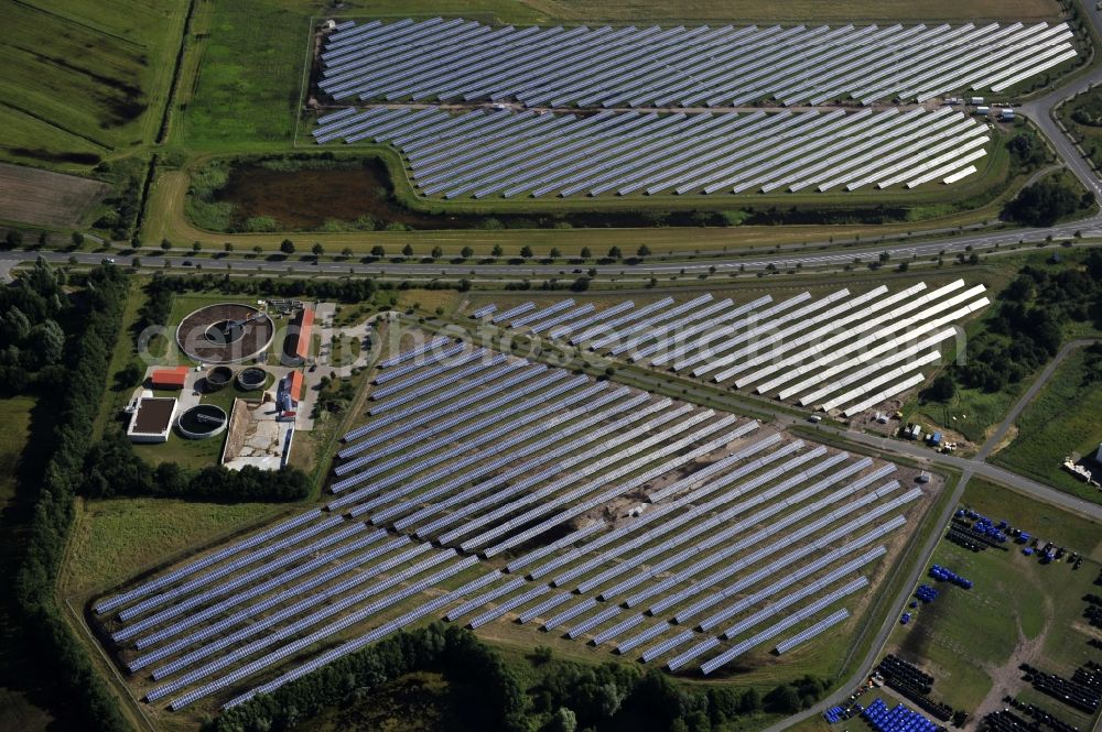 Boizenburg from the bird's eye view: Boizenburg 08/07/2012 Newly built solar panel, photovoltaic solar park or along the road 5 on the industrial and commercial area of the eastern edge of Boizenburg / Elbe. The plant operator is the EEPro Company