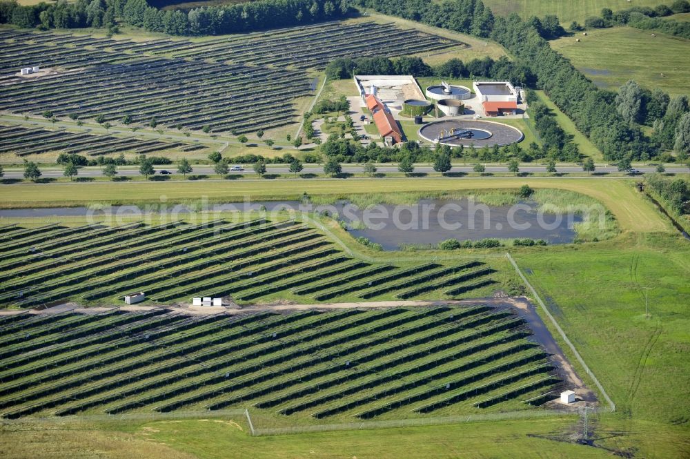 Boizenburg from above - Boizenburg 08/07/2012 Newly built solar panel, photovoltaic solar park or along the road 5 on the industrial and commercial area of the eastern edge of Boizenburg / Elbe. The plant operator is the EEPro Company