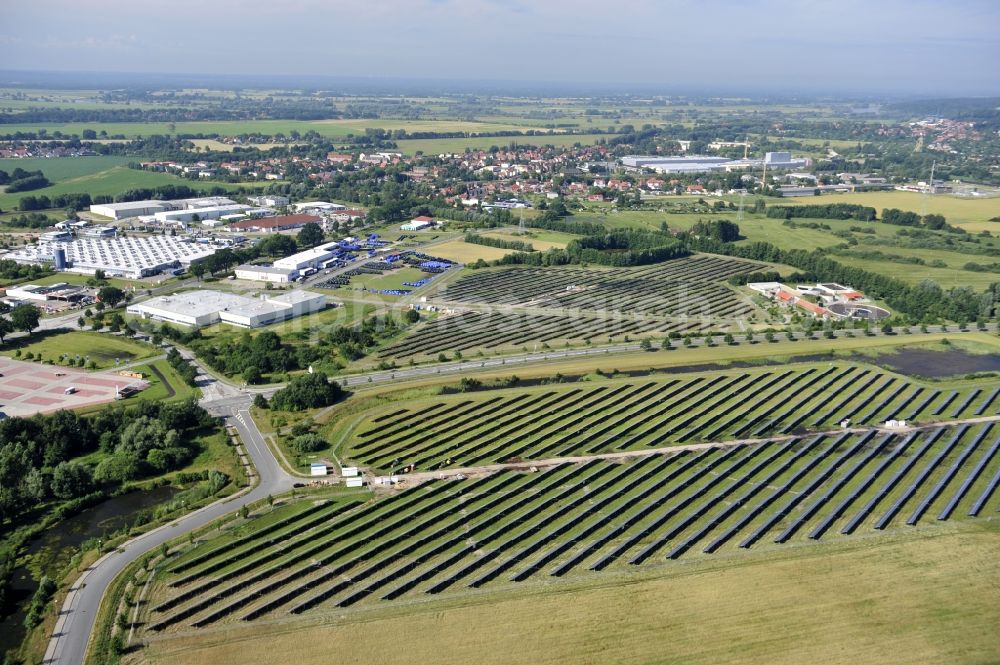 Boizenburg from above - Boizenburg 08/07/2012 Newly built solar panel, photovoltaic solar park or along the road 5 on the industrial and commercial area of the eastern edge of Boizenburg / Elbe. The plant operator is the EEPro Company