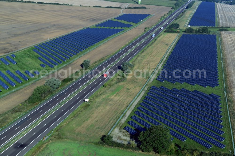 Kuckuck from the bird's eye view: Solar fields of photovoltaic power plant along the course of the A24 motorway at Kuckuk in Brandenburg