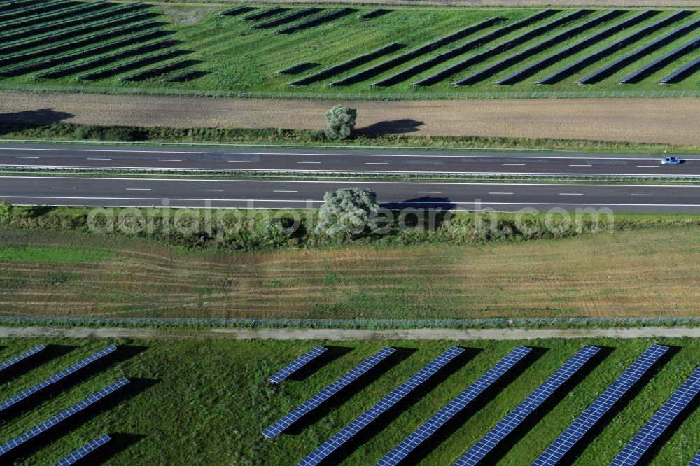 Kuckuck from the bird's eye view: Solar fields of photovoltaic power plant along the course of the A24 motorway at Kuckuk in Brandenburg