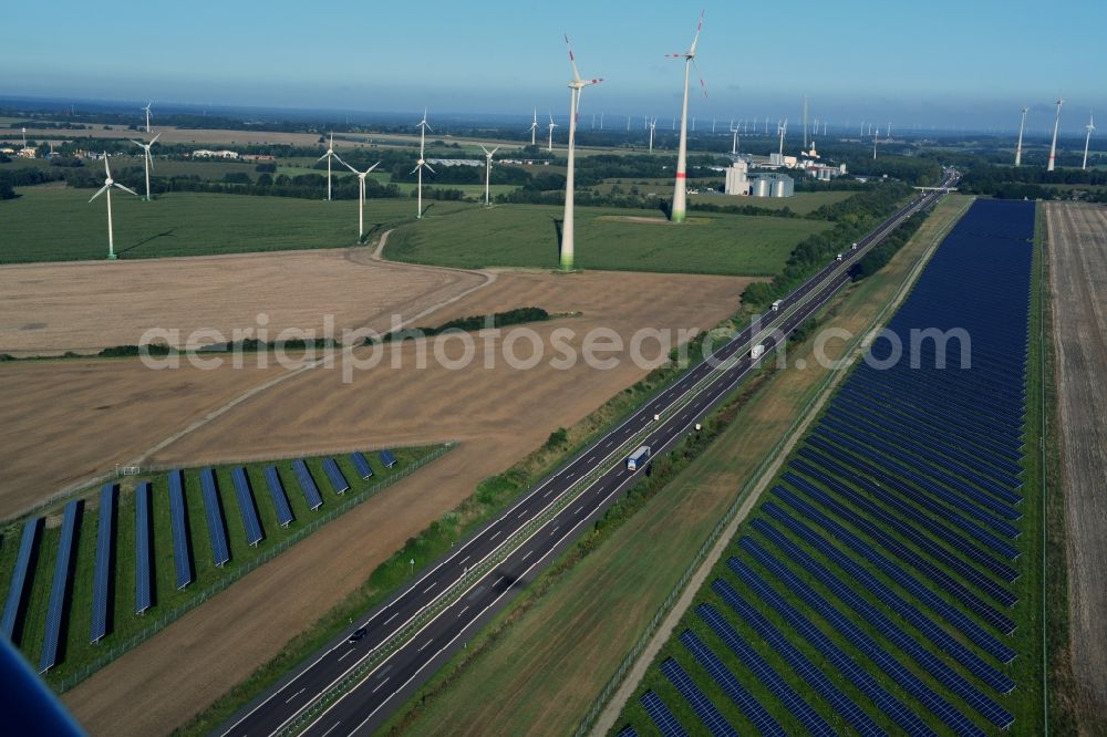 Kuckuck from the bird's eye view: Solar fields of photovoltaic power plant along the course of the A24 motorway at Kuckuk in Brandenburg