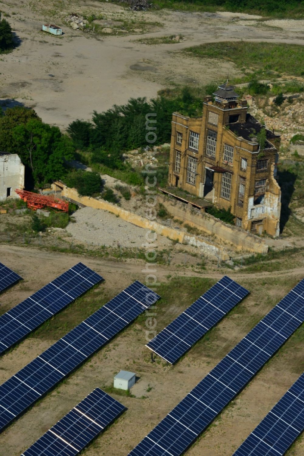 Muldenstein from above - Photovoltaic systems at the solar power plant on the facade ruins of the old pipe plant Muldenstein in the state of Saxony-Anhalt