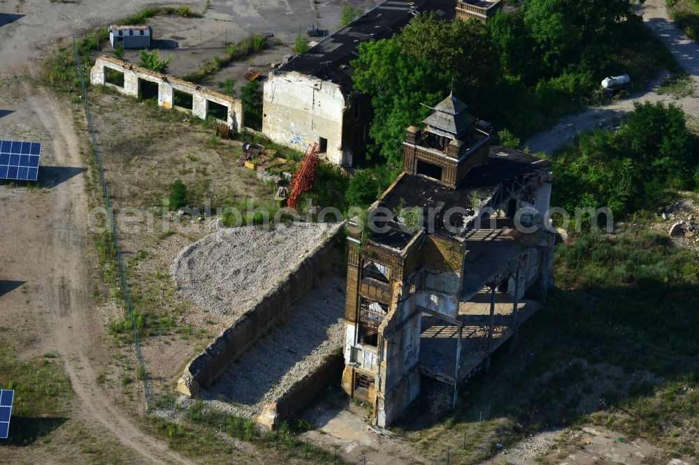 Muldenstein from the bird's eye view: Photovoltaic systems at the solar power plant on the facade ruins of the old pipe plant Muldenstein in the state of Saxony-Anhalt