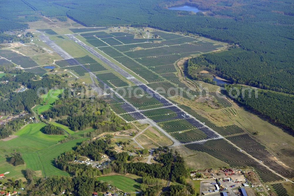 Aerial image Eberswalde - View of the almost fully assembled solar fields of the new solar power plant Finow Tower. The hybrid solar AG is currently building on the former military airport, a solar power plant