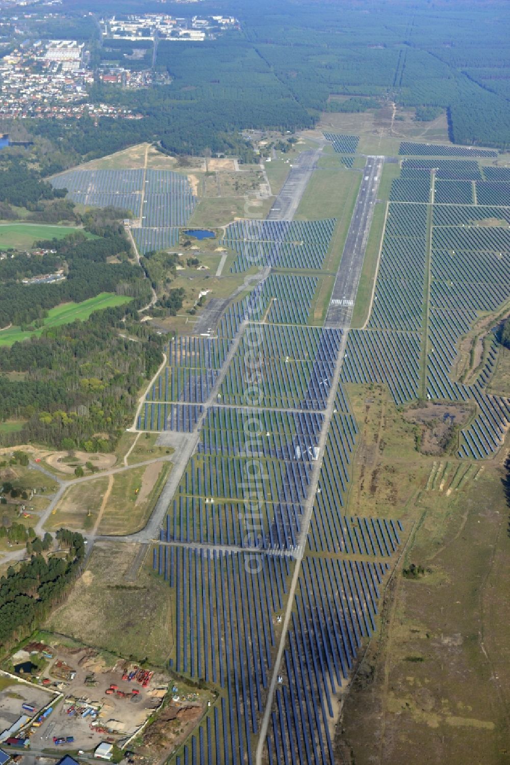 Eberswalde from above - View of the almost fully assembled solar fields of the new solar power plant Finow Tower. The hybrid solar AG is currently building on the former military airport, a solar power plant