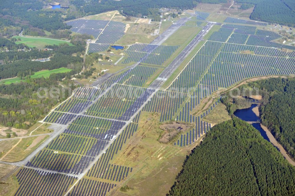 Aerial image Eberswalde - View of the almost fully assembled solar fields of the new solar power plant Finow Tower. The hybrid solar AG is currently building on the former military airport, a solar power plant