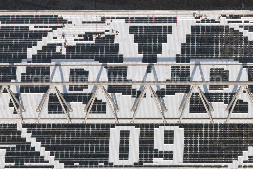 Dortmund from the bird's eye view: Mit Solarpaneelen / Solarflächen als BVB - Logo aufgerüstetes Dach des Borusseum , dem Stadion Signal Iduna Park des BVB. With solar panels as BVB - logo has been upgraded roof of Borusseum, the Signal Iduna Park stadium of Borussia Dortmund.