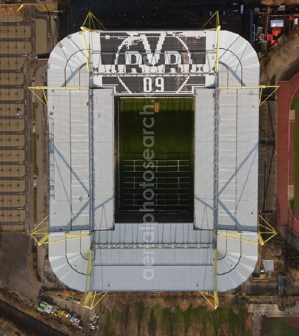 Dortmund from above - Mit Solarpaneelen / Solarflächen als BVB - Logo aufgerüstetes Dach des Borusseum , dem Stadion Signal Iduna Park des BVB. With solar panels as BVB - logo has been upgraded roof of Borusseum, the Signal Iduna Park stadium of Borussia Dortmund.