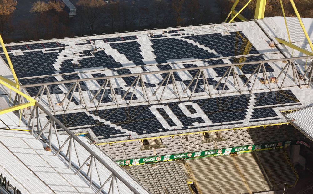 Dortmund from the bird's eye view: Mit Solarpaneelen / Solarflächen als BVB - Logo aufgerüstetes Dach des Borusseum , dem Stadion Signal Iduna Park des BVB. With solar panels as BVB - logo has been upgraded roof of Borusseum, the Signal Iduna Park stadium of Borussia Dortmund.