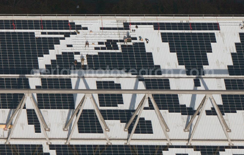 Aerial image Dortmund - Mit Solarpaneelen / Solarflächen als BVB - Logo aufgerüstetes Dach des Borusseum , dem Stadion Signal Iduna Park des BVB. With solar panels as BVB - logo has been upgraded roof of Borusseum, the Signal Iduna Park stadium of Borussia Dortmund.