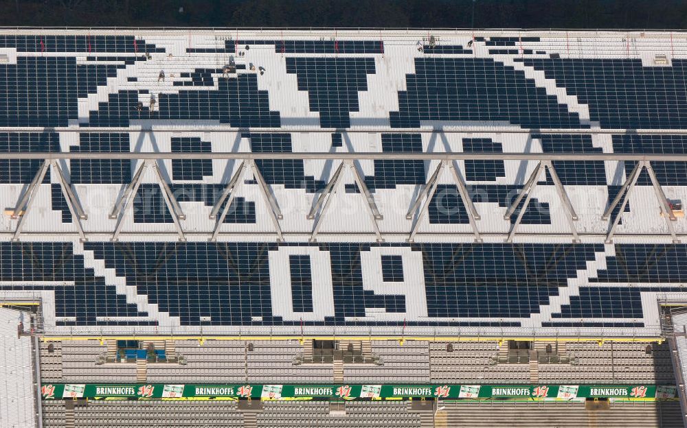 Aerial photograph Dortmund - Mit Solarpaneelen / Solarflächen als BVB - Logo aufgerüstetes Dach des Borusseum , dem Stadion Signal Iduna Park des BVB. With solar panels as BVB - logo has been upgraded roof of Borusseum, the Signal Iduna Park stadium of Borussia Dortmund.