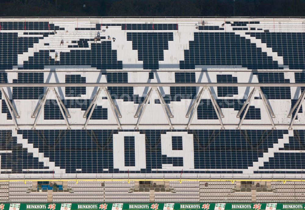 Dortmund from above - Mit Solarpaneelen / Solarflächen als BVB - Logo aufgerüstetes Dach des Borusseum , dem Stadion Signal Iduna Park des BVB. With solar panels as BVB - logo has been upgraded roof of Borusseum, the Signal Iduna Park stadium of Borussia Dortmund.