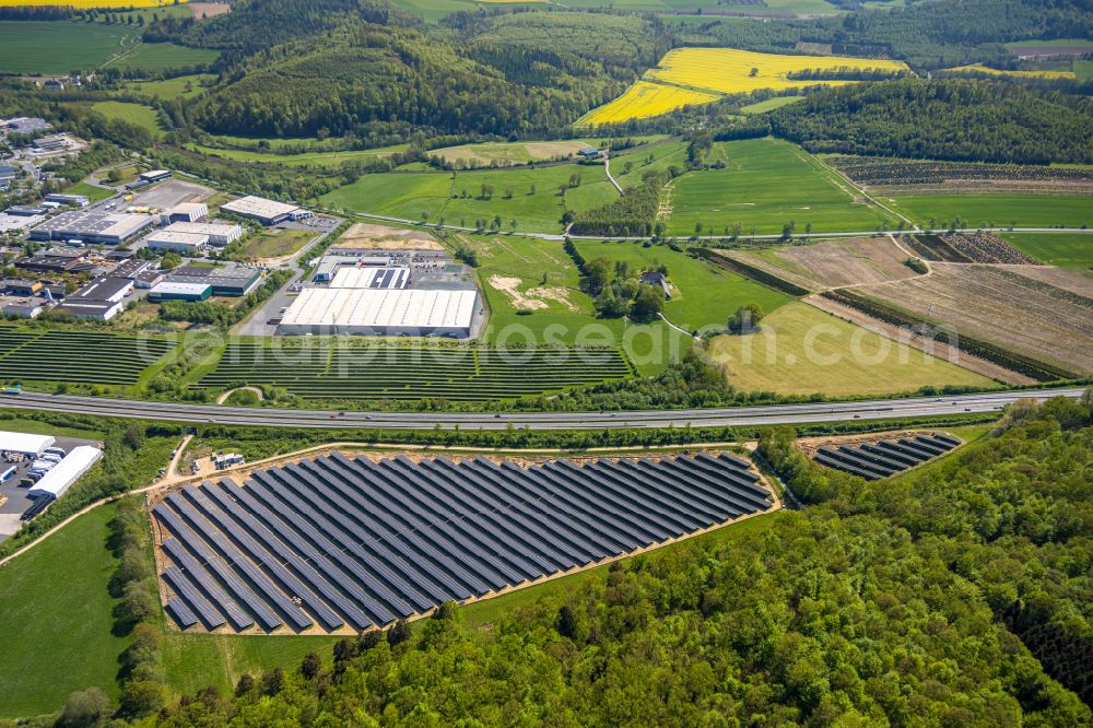 Aerial image Enste - Rows of panels of a solar power plant and photovoltaic system on Autobahn BAB A46 in Enste at Sauerland in the state North Rhine-Westphalia, Germany