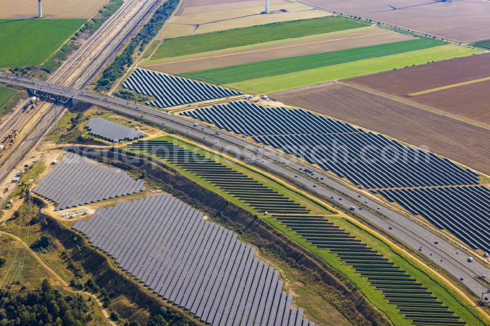 Aerial photograph Bedburg - Solar power plant and photovoltaic systems on the A44 road in Bedburg in the state of North Rhine-Westphalia, Germany