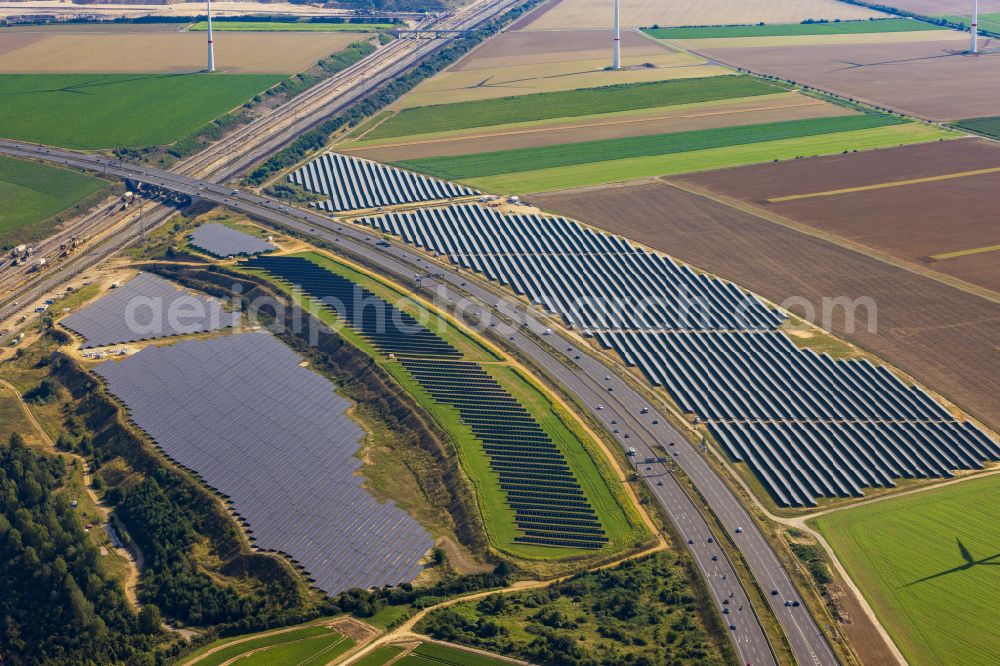 Bedburg from the bird's eye view: Solar power plant and photovoltaic systems on the A44 road in Bedburg in the state of North Rhine-Westphalia, Germany