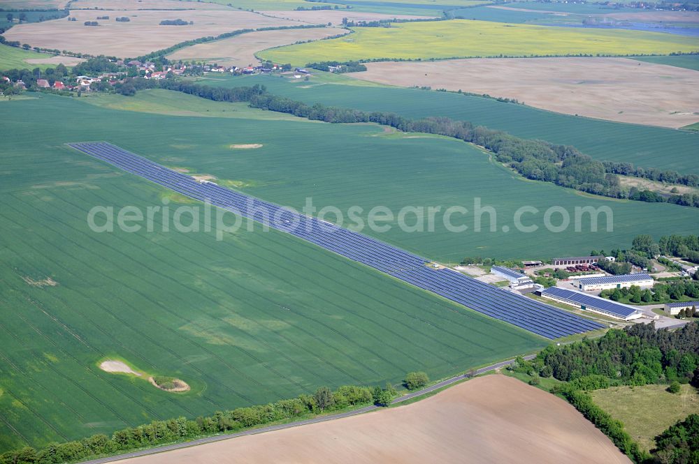 Dedelow from the bird's eye view: Solar power plant and photovoltaic systems on the former runway with the tarmac area of the airfield in Dedelow in the state Brandenburg, Germany