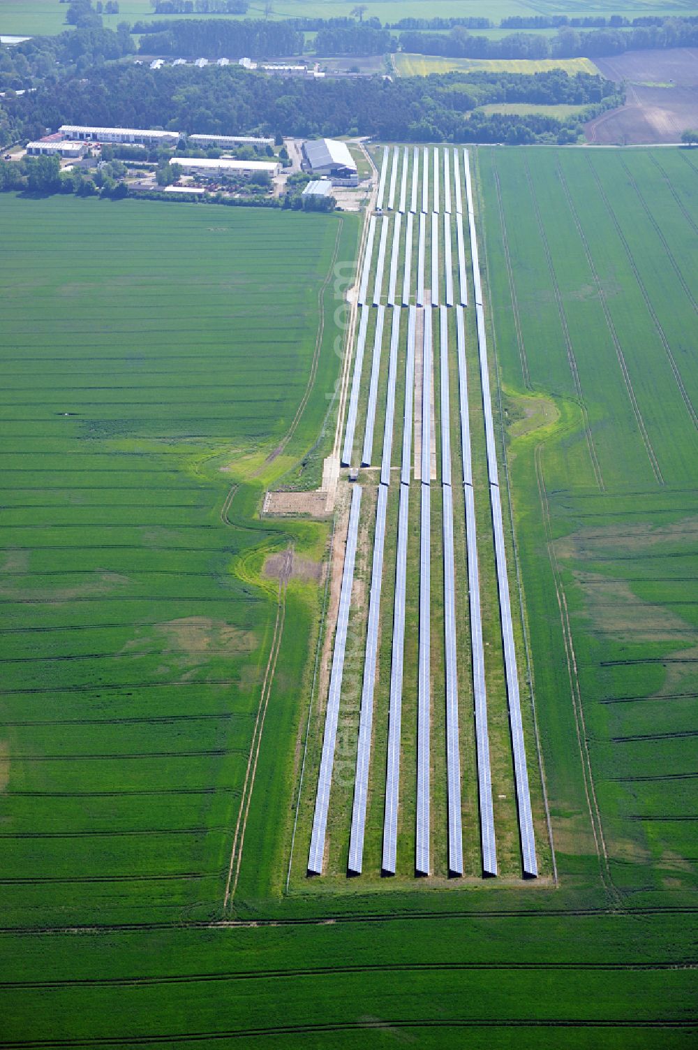 Aerial image Dedelow - Solar power plant and photovoltaic systems on the former runway with the tarmac area of the airfield in Dedelow in the state Brandenburg, Germany