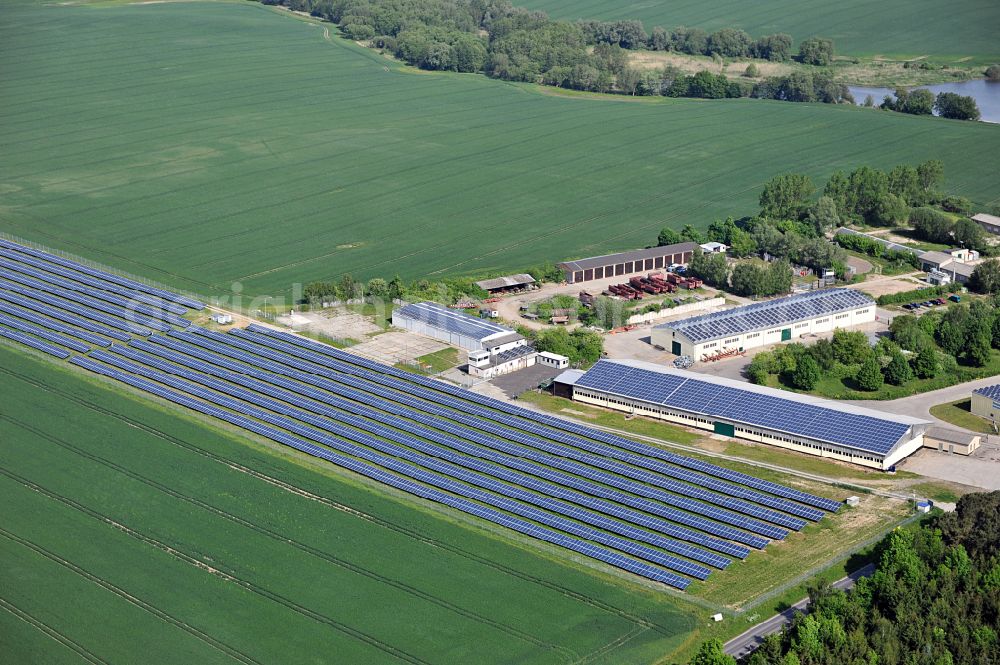 Dedelow from the bird's eye view: Solar power plant and photovoltaic systems on the former runway with the tarmac area of the airfield in Dedelow in the state Brandenburg, Germany