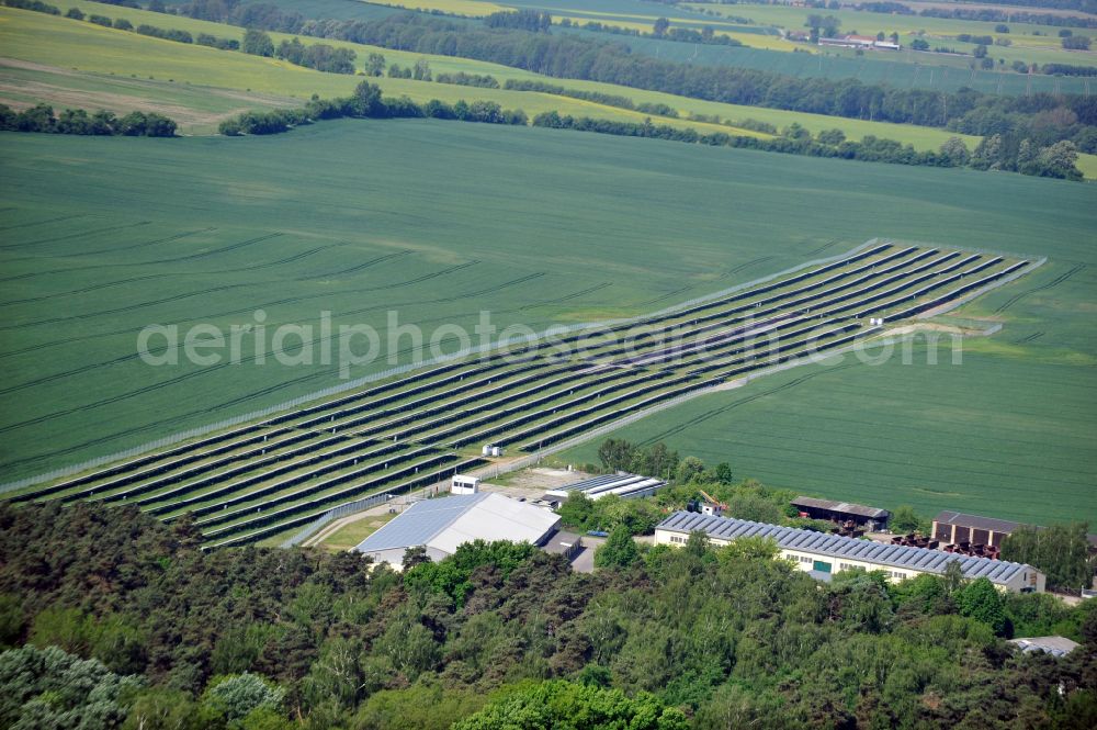 Dedelow from above - Solar power plant and photovoltaic systems on the former runway with the tarmac area of the airfield in Dedelow in the state Brandenburg, Germany