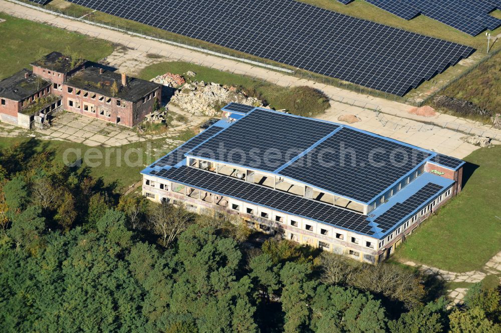 Aerial image Fürstenwalde/Spree - Panel rows of a solar power plant and photovoltaic system on old hangar halls and the former airfield field in Fuerstenwalde/Spree in the state Brandenburg, Germany