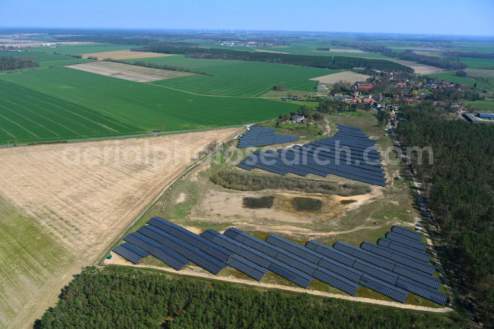 Aerial photograph Kleinau - Rows of panels of a solar power plant and photovoltaic system on a field in Lohne in the state Saxony-Anhalt, Germany