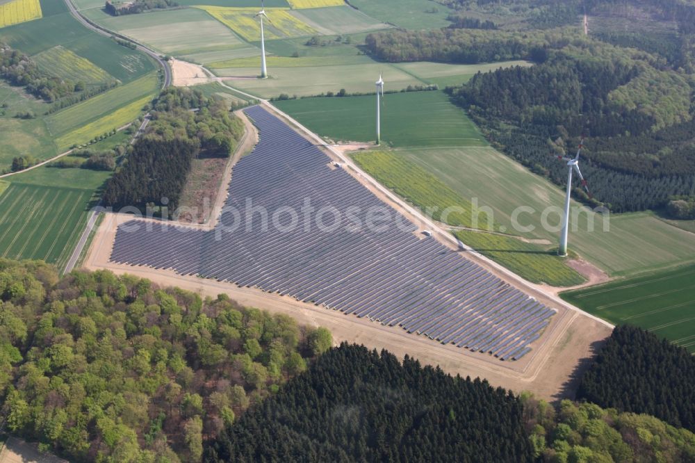 Mastershausen from above - Rows of panels of a solar power plant and photovoltaic system on a field in Mastershausen in the state Rhineland-Palatinate, Germany