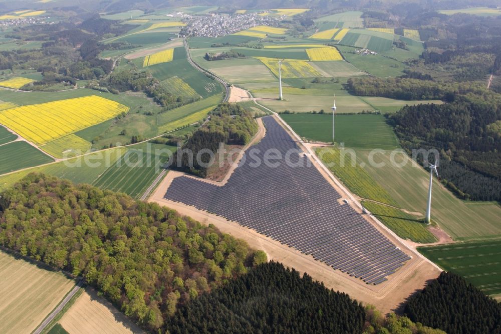 Mastershausen from the bird's eye view: Rows of panels of a solar power plant and photovoltaic system on a field in Mastershausen in the state Rhineland-Palatinate, Germany