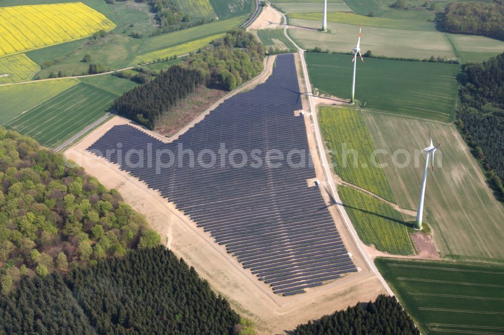 Aerial image Mastershausen - Rows of panels of a solar power plant and photovoltaic system on a field in Mastershausen in the state Rhineland-Palatinate, Germany