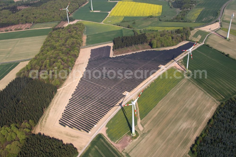 Aerial photograph Mastershausen - Rows of panels of a solar power plant and photovoltaic system on a field in Mastershausen in the state Rhineland-Palatinate, Germany