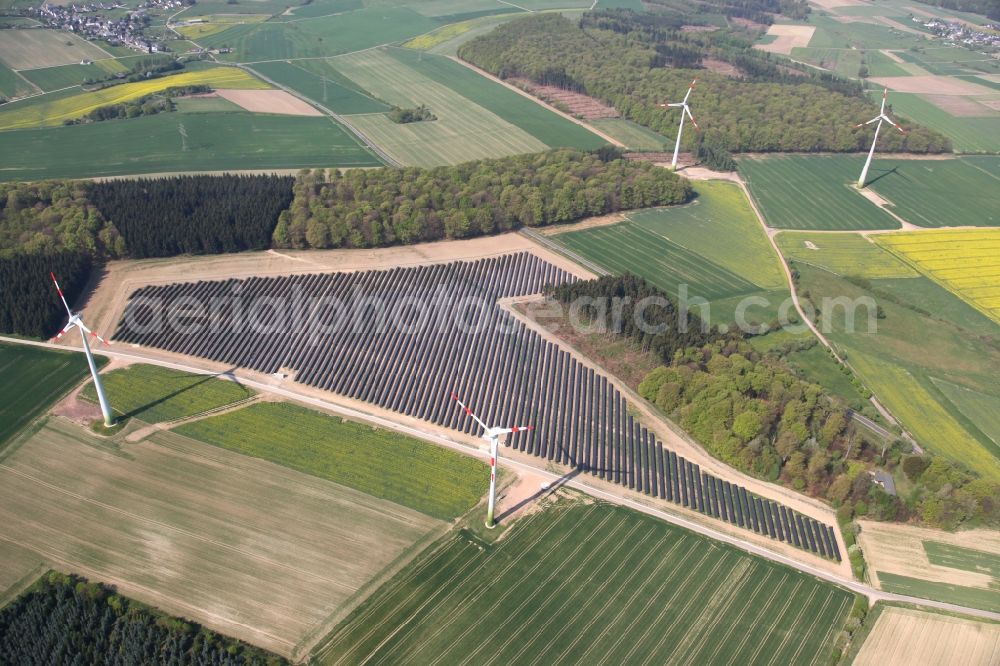 Mastershausen from above - Rows of panels of a solar power plant and photovoltaic system on a field in Mastershausen in the state Rhineland-Palatinate, Germany