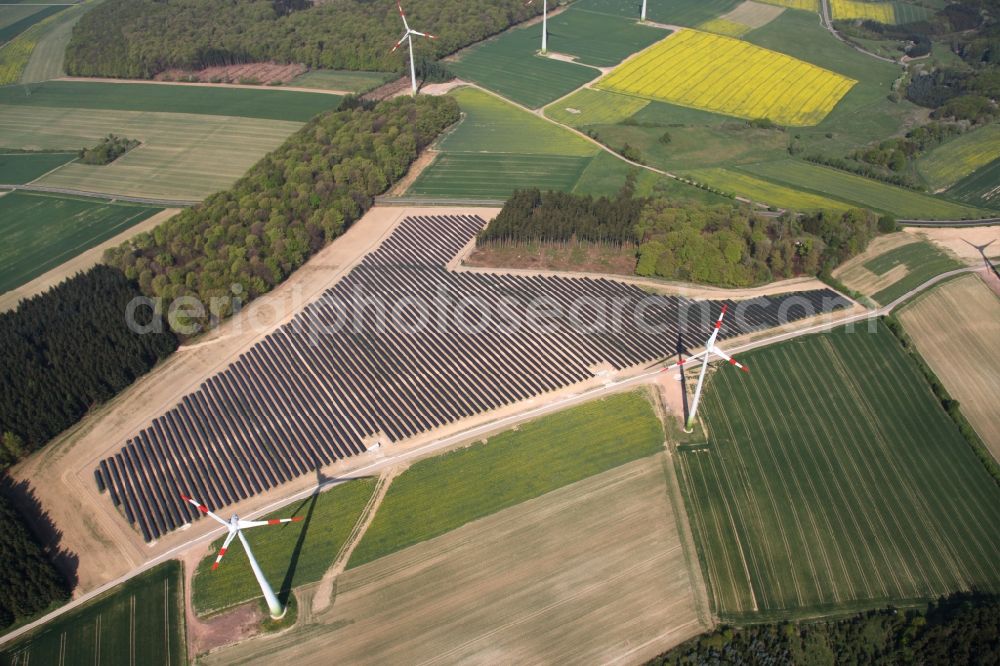 Mastershausen from the bird's eye view: Rows of panels of a solar power plant and photovoltaic system on a field in Mastershausen in the state Rhineland-Palatinate, Germany